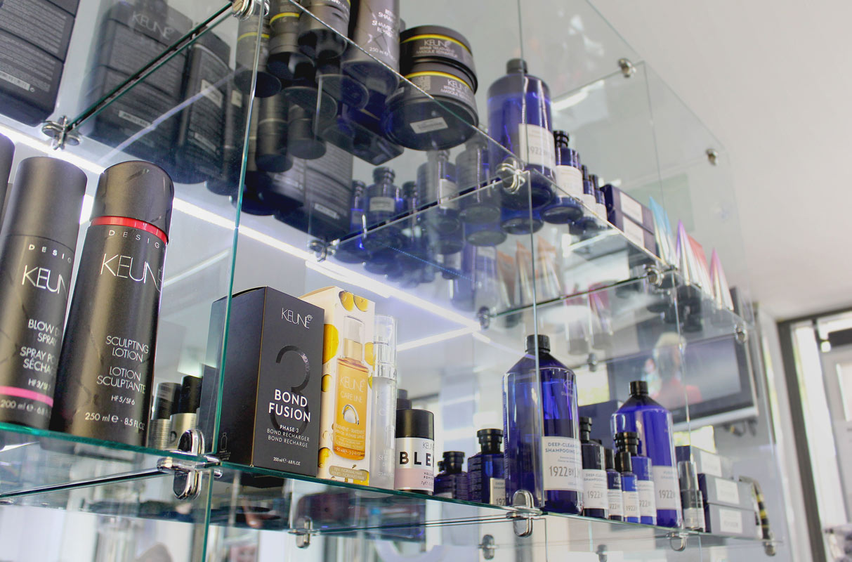 A shelf full of Keune products